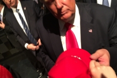 Trump taking his hat...